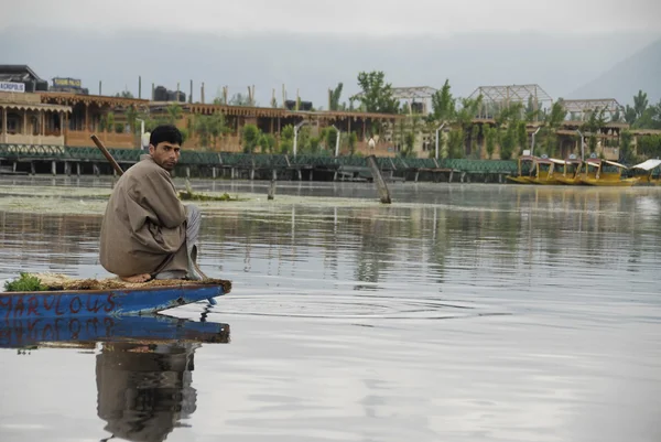 Kashmiri man goes fishing in the Dal Lake, Srinagar, India.