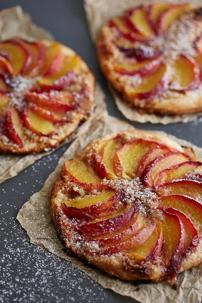 Peach pies on gray background