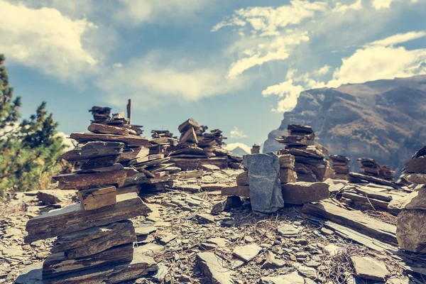 Stone piles with mountain on background.