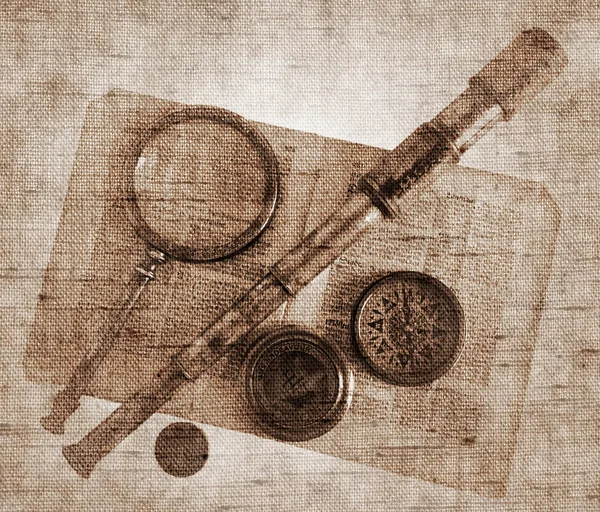 Vintage telescope, magnifying glass, compass and paper