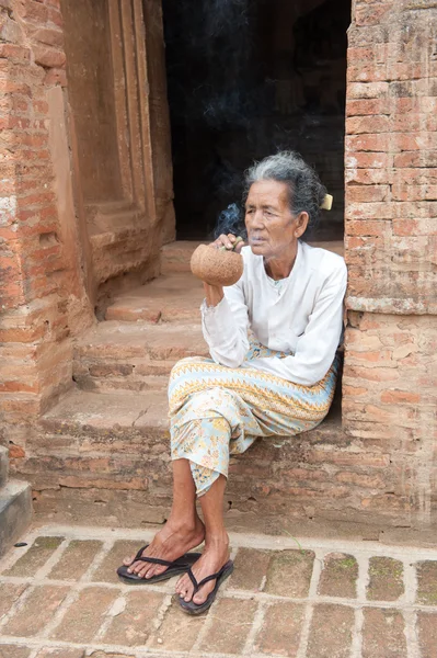 Asiatic old woman smoking