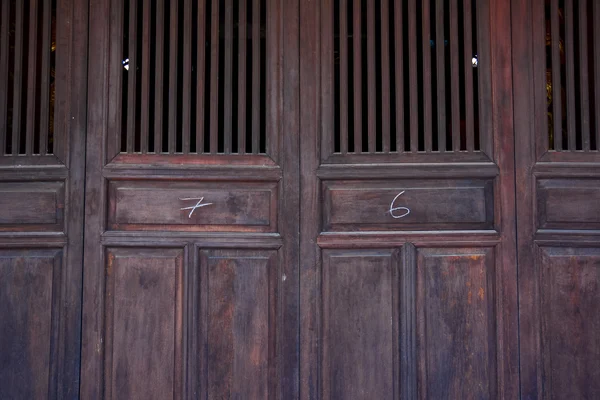 Chinese old wooden door in a ancient building