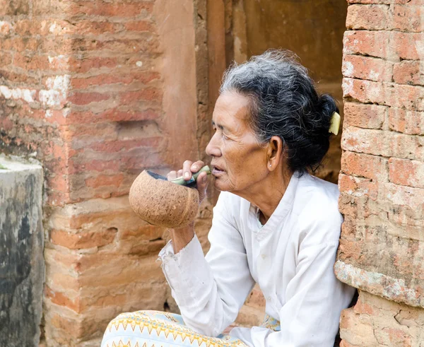 Asiatic old woman smoking