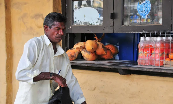 Portrait of elderly market vendor