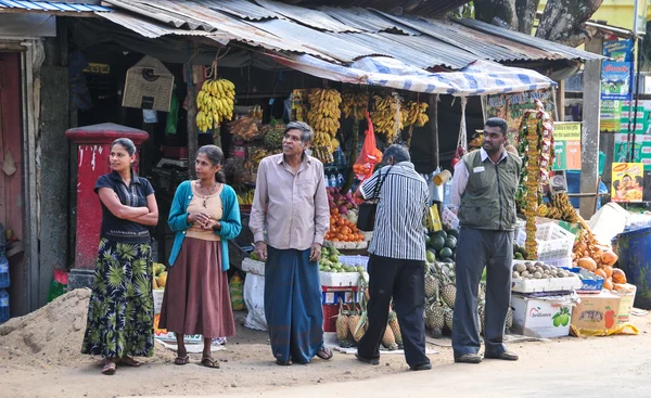 Sellers in street shop sell fresh fruits in Sri Lanka