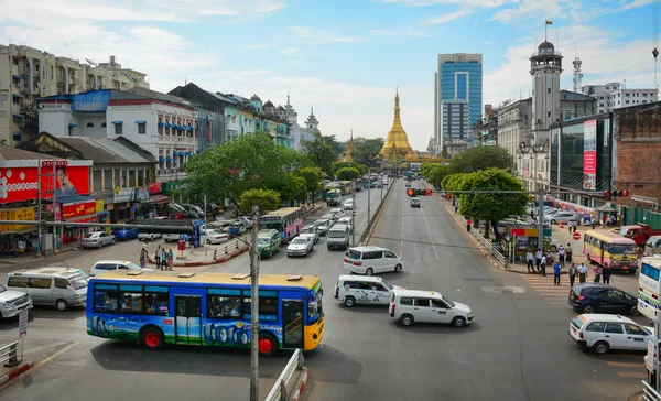 Traffic, people, and buildings in downtown Yangon