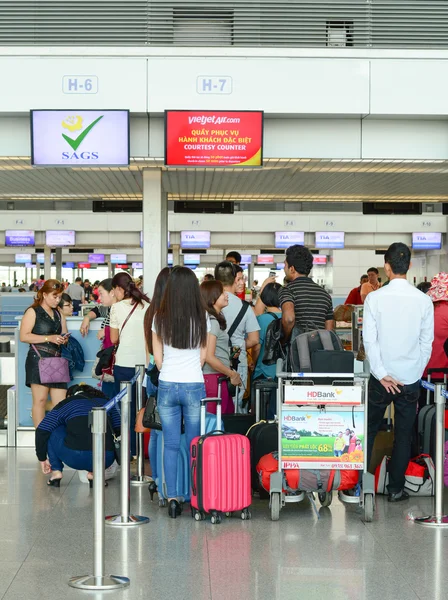 Asian travellers at arrival terminal in Tan Son Nhat