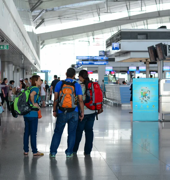 Asian travellers at arrival terminal in Tan Son Nhat
