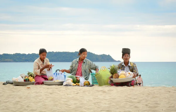 Burmese woman selling fresh fruits on Ngapali beach