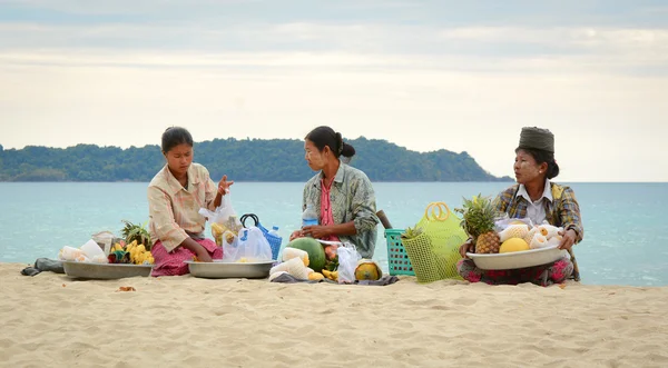 Burmese woman selling fresh fruits on Ngapali beach
