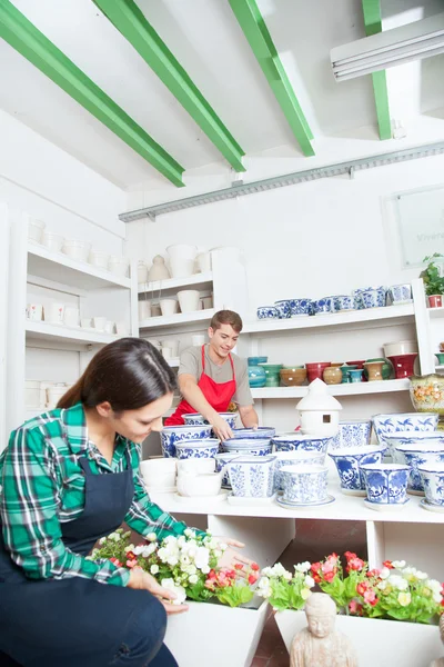 Man and woman working in shop