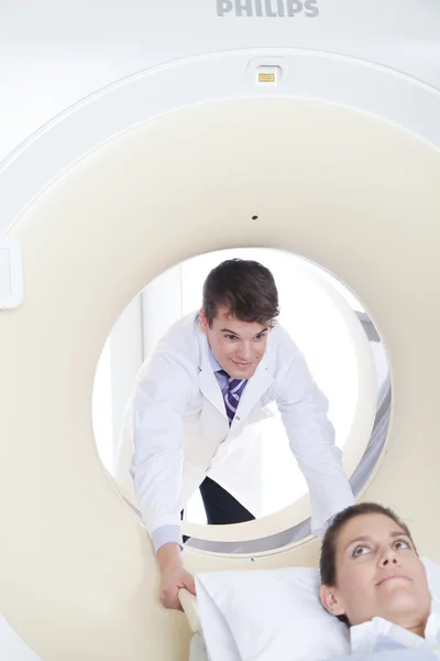 Doctor doing tomography to patient