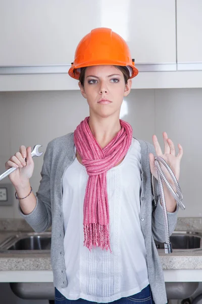 Woman plumber with tools