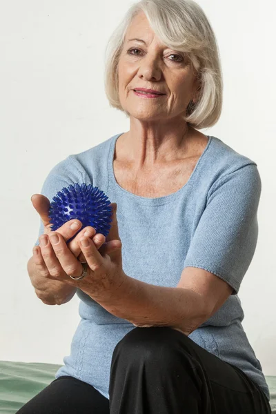 Elderly Woman who rehabilitates his hand