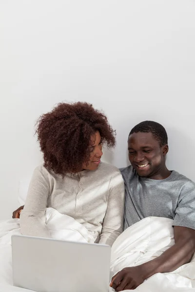 African couple using laptop computer