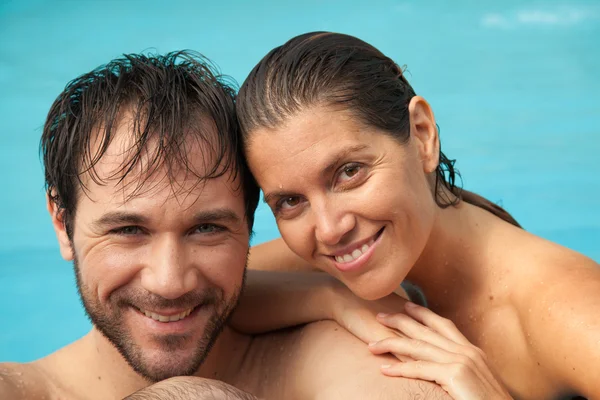 Couple having fun in pool