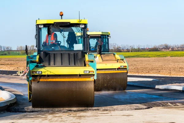 Road rollers working on the construction site