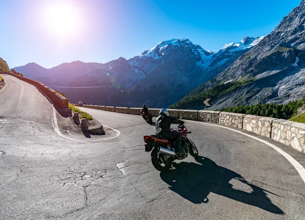 Sunset above motorbike on Passo Stelvio