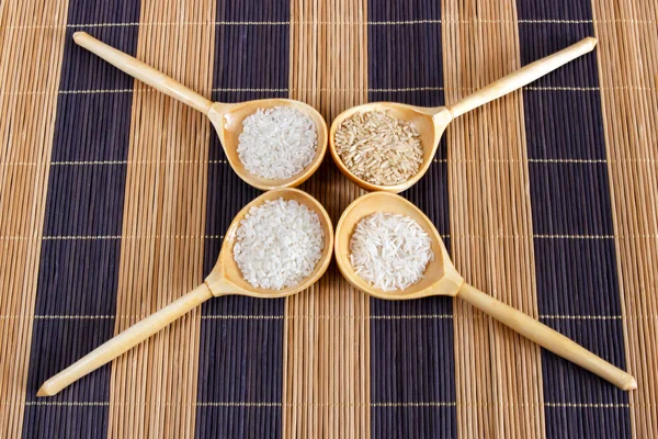 Bamboo mat, basmati, basmati rice, brown, brown rice, food, four kinds of rice, healthy food, long, long grain rice, natural food, plant food, rice types of rice, round, round grain rice, still life, white, white rice, wooden spoon, wooden spoons, wo