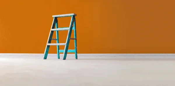 Aqua wooden ladder on yellow background