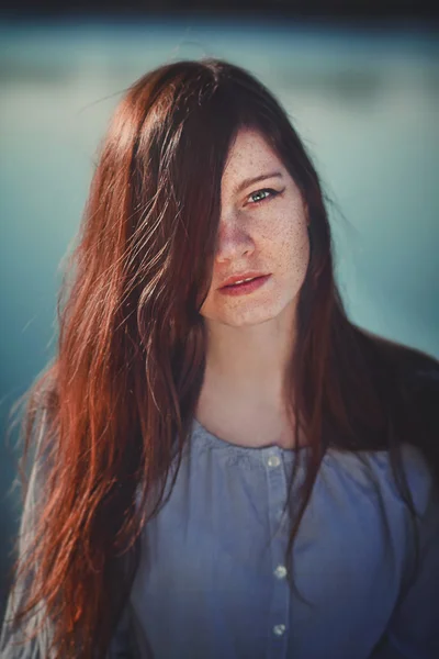 Expressive portrait of a girl with freckles