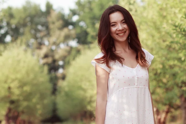 Beautiful young girl in the garden