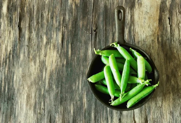 Pods of fresh green peas