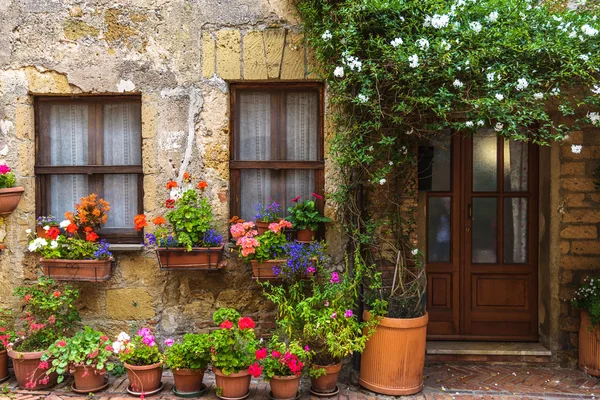 Flower filled streets of the old Italian city in Tuscany.