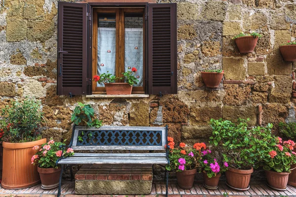 Flower filled streets of the old Italian city in Tuscany.