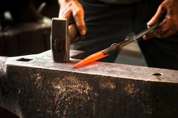 Hard and dirty work at a blacksmith