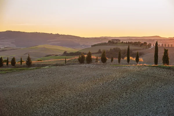 The setting sun over the valley of the Orcia in Tuscany, Italy