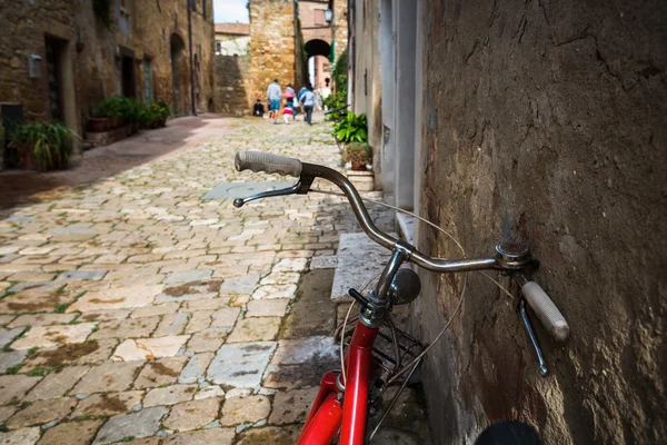 Abandoned bike on the Italian street in the old Tuscany