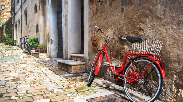 Abandoned bike on the Italian street in the old Tuscany