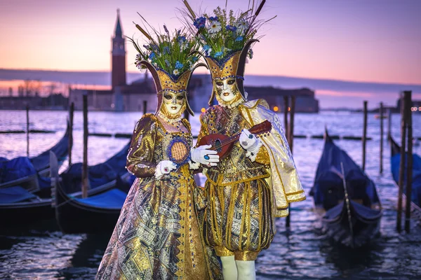 Costumed couple on the San Marco square during Carnival in Venic