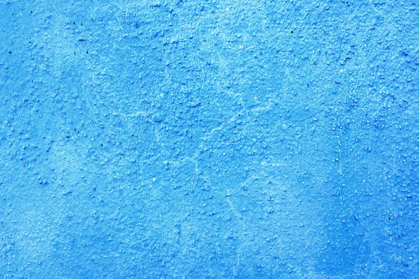 Piece of blue wall with plaster as a background