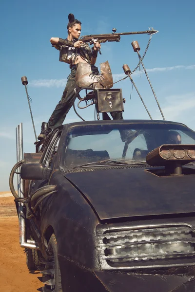 Woman warrior in  futuristic  clothes with car