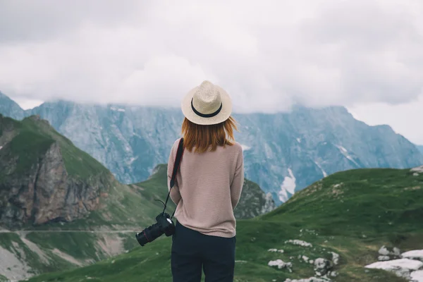 Fashionable girl relaxing outdoor travel freedom lifestyle with mountains on background