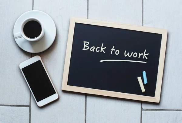 Chalkboard or Blackboard concept saying Back to Work