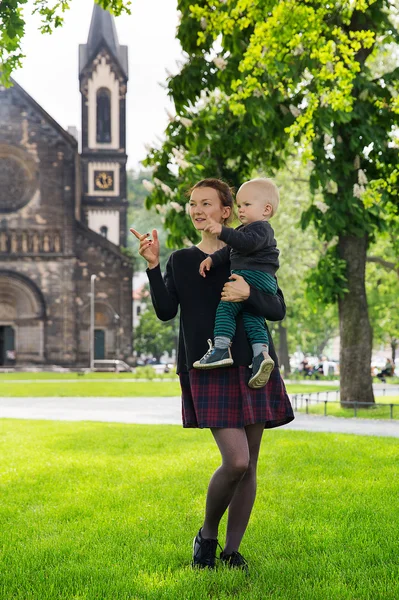 Family of Tourists on the Background of Church of St. Cyril and Methodius in the Karlin, Karlinske namesti, Prague, Czech Republic.