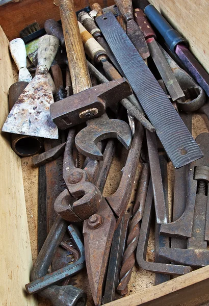 Dirty set of hand tools, vintage background with old tools