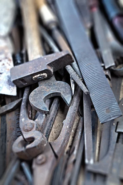 Dirty set of hand tools, vintage background with old tools