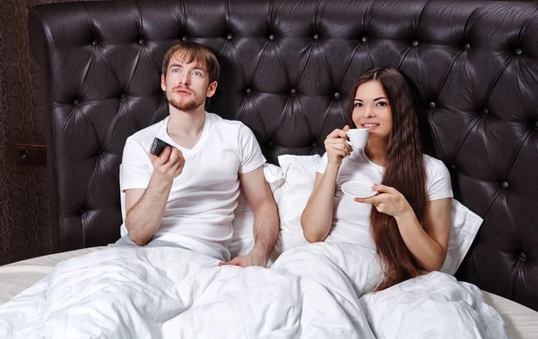 Morning couples. Coffee and TV.