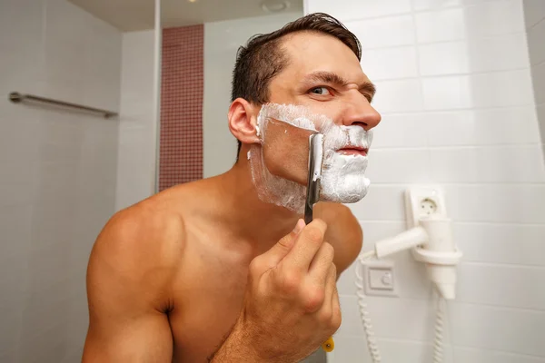 Man shaving razor.