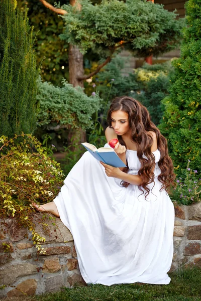 Girl with enthusiasm reads book