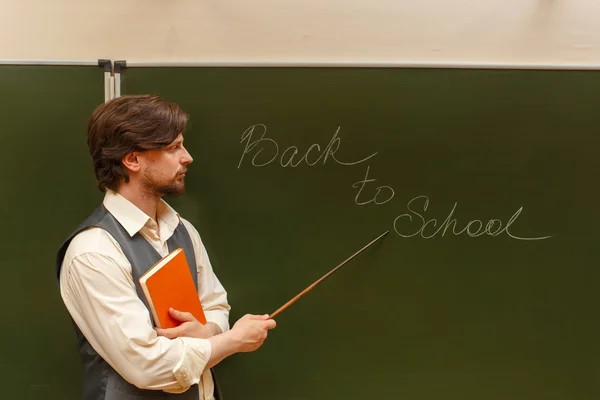 Teacher shows pointer on back to school.