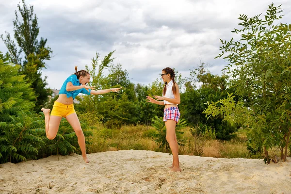 Best friends have fun at the beach.