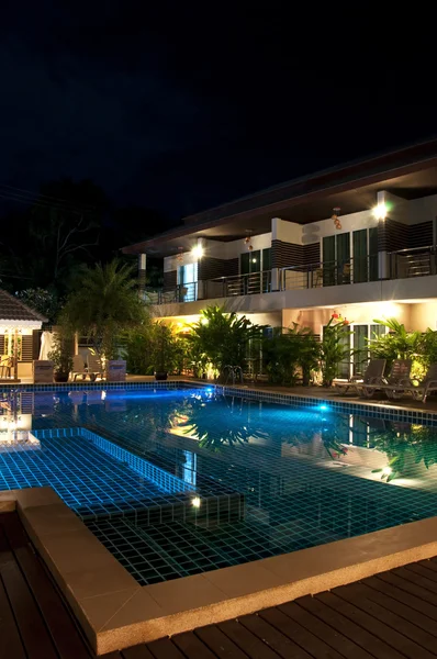 Resort with swimming pool at night