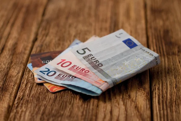 Two credit cards placed in euro bills