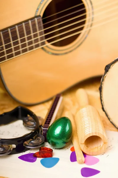 Vertical photo of egg shaker among other instruments