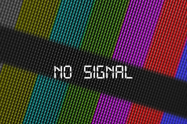 Closeup pixels of LCD TV screen with color bars and message no signal is a television test pattern